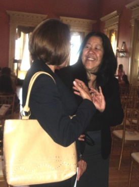 Two women talking and smiling