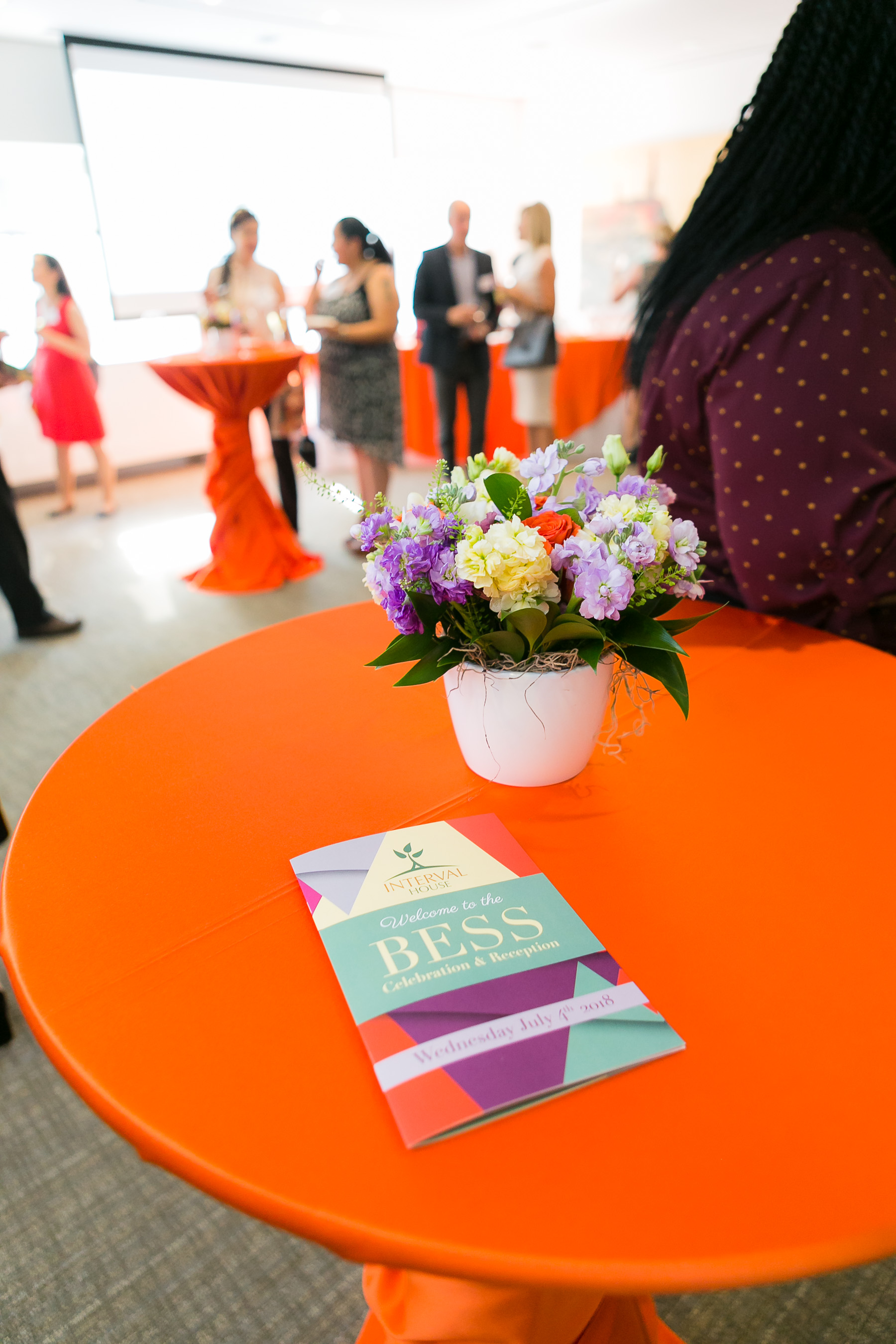 an orange table with a BESS brochure on it